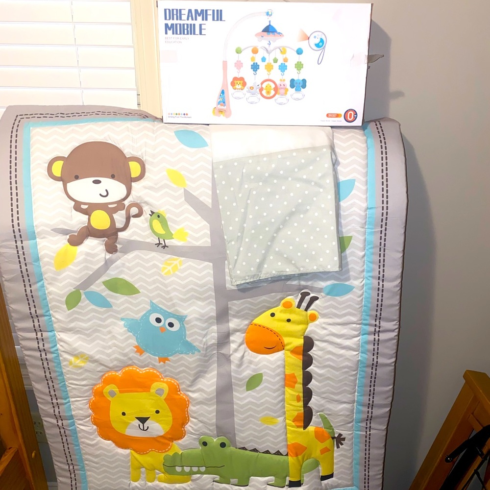 Crib comforter, mobile and mattress skirt